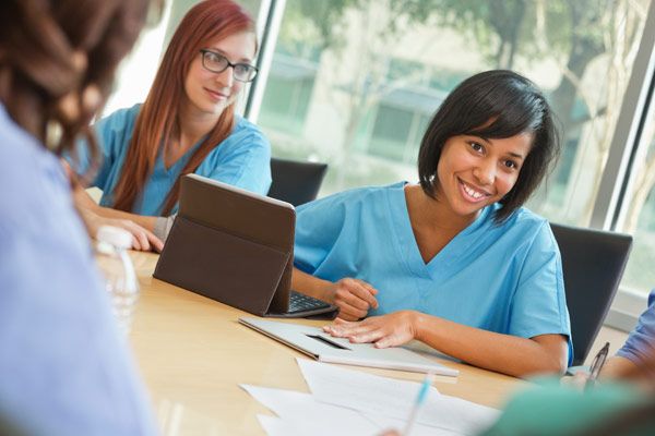 Medical Office Assistants in a meeting