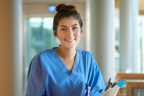 A Medical Office Assistant working with files